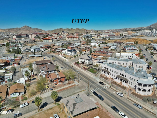 birds eye view of property featuring a mountain view