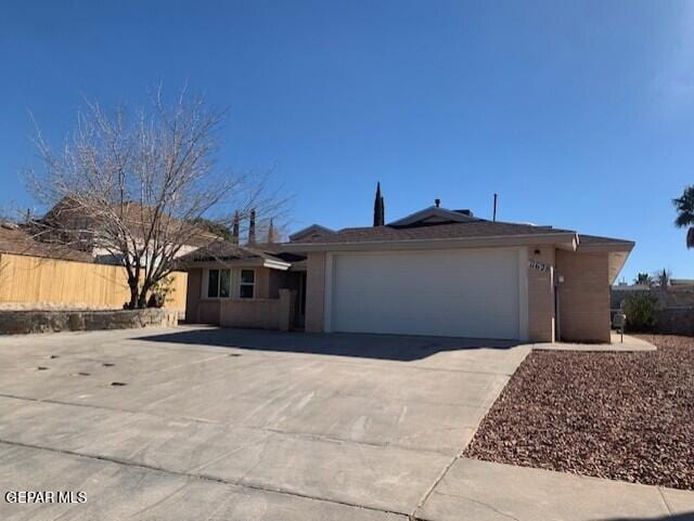 single story home featuring a garage