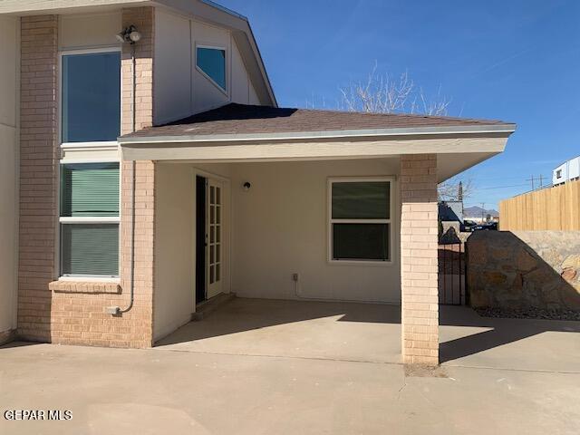 rear view of property featuring a patio