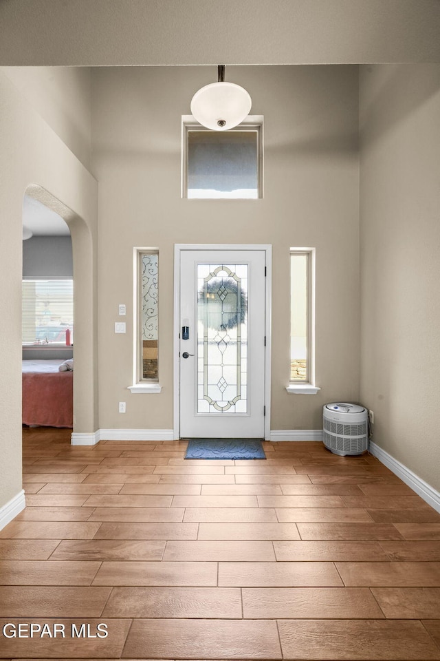 foyer entrance with light hardwood / wood-style floors