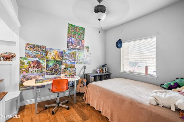 bedroom featuring hardwood / wood-style floors and ceiling fan