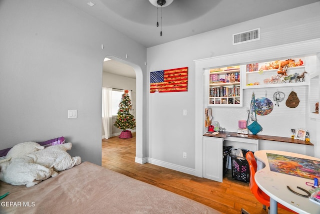 bedroom with hardwood / wood-style flooring and ceiling fan