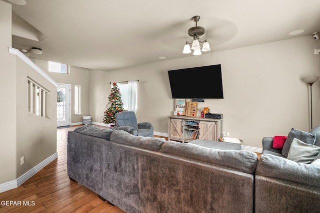 living room with ceiling fan and hardwood / wood-style floors