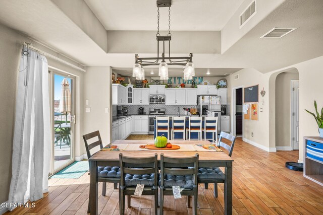 dining area with light wood-type flooring