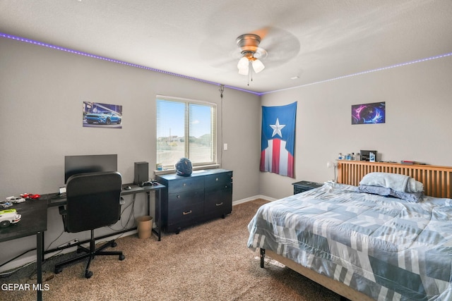 bedroom with ceiling fan and carpet floors