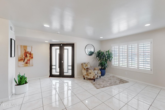 entrance foyer with french doors and light tile patterned floors