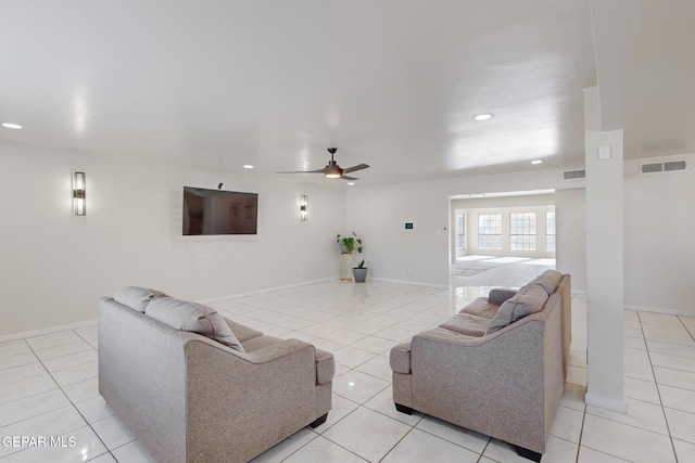 living room with ceiling fan and light tile patterned floors