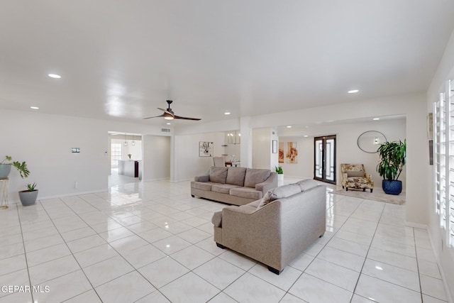 living room with light tile patterned floors and ceiling fan