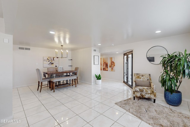 dining space with light tile patterned floors and a notable chandelier