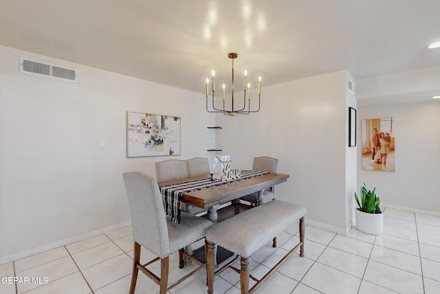 dining area with a notable chandelier and light tile patterned floors