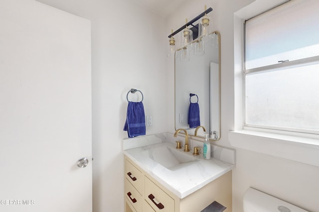 bathroom with vanity and toilet