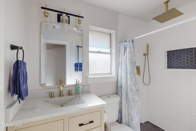 bathroom with vanity, toilet, and walk in shower