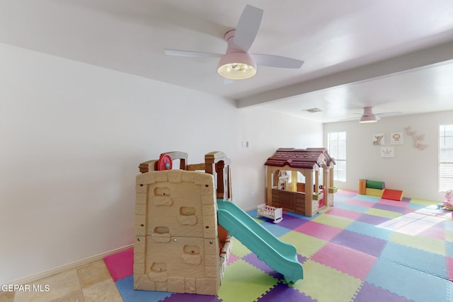 playroom featuring beamed ceiling and ceiling fan