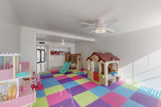 game room with ceiling fan and plenty of natural light