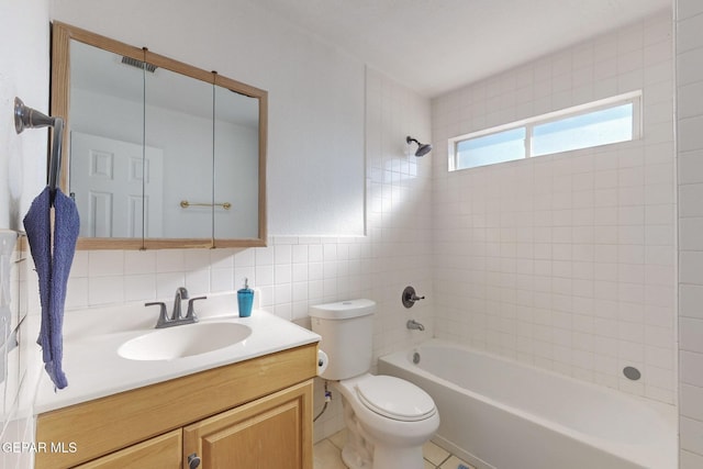 full bathroom with backsplash, toilet, vanity, tile walls, and tiled shower / bath