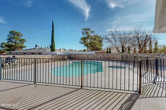 view of swimming pool featuring a patio area