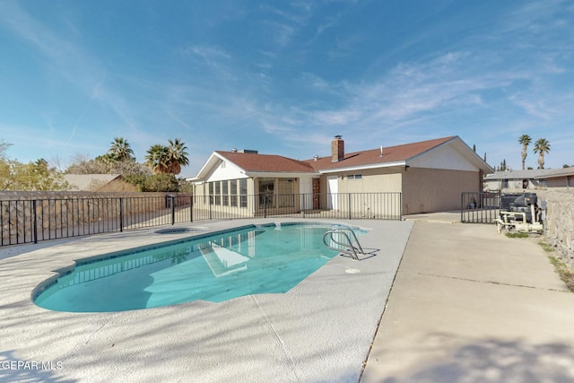 view of swimming pool featuring a patio