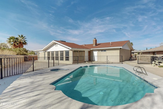 view of pool featuring a patio