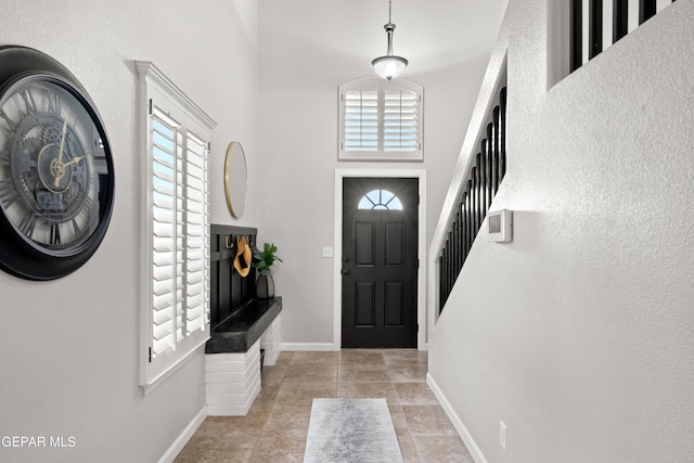 entrance foyer featuring plenty of natural light and a high ceiling