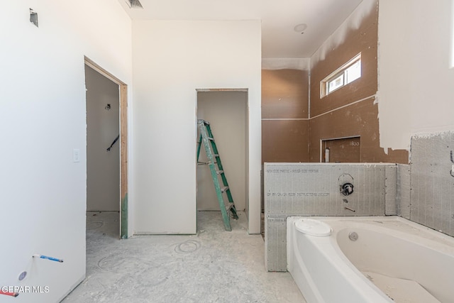 bathroom featuring a tub