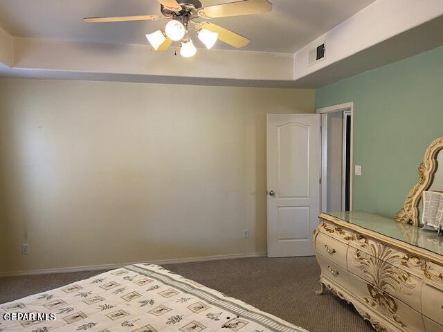 unfurnished bedroom with ceiling fan and carpet floors