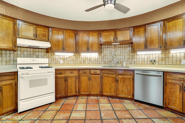 kitchen featuring gas range gas stove, dishwasher, ceiling fan, sink, and backsplash