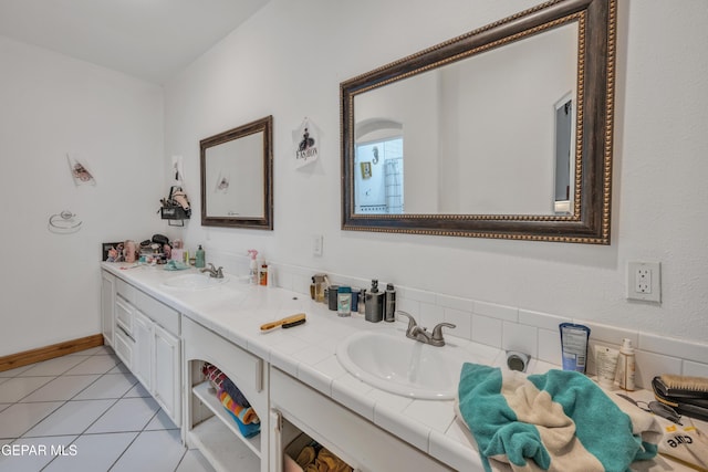 bathroom with tile patterned flooring and vanity