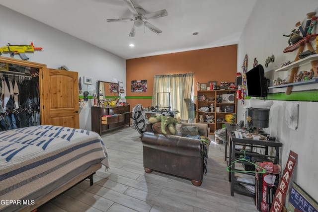 bedroom with ceiling fan and a closet