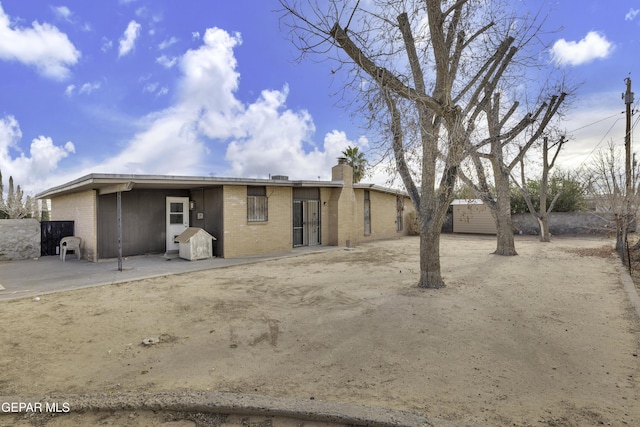 rear view of house featuring a patio