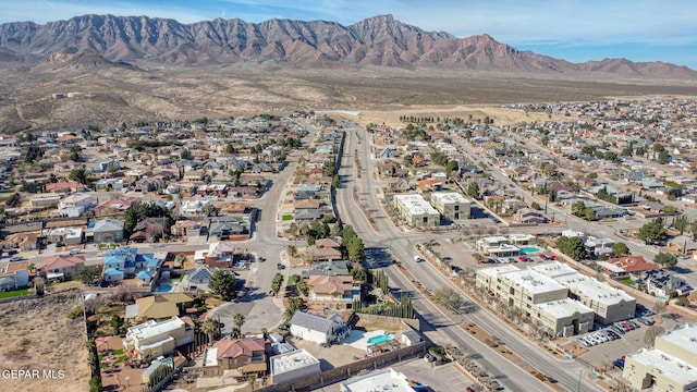 birds eye view of property with a mountain view