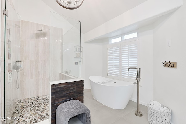 bathroom featuring separate shower and tub and tile patterned flooring