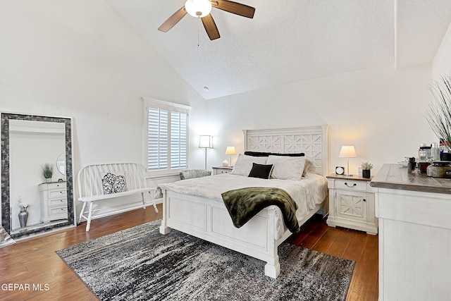 bedroom featuring ceiling fan, high vaulted ceiling, dark wood-type flooring, and a textured ceiling