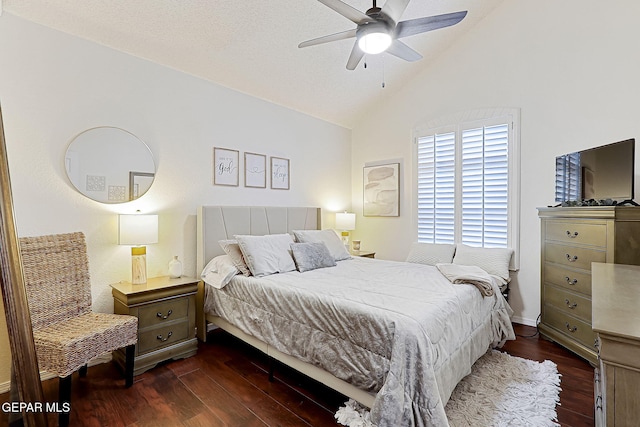 bedroom with dark wood-type flooring, ceiling fan, and lofted ceiling