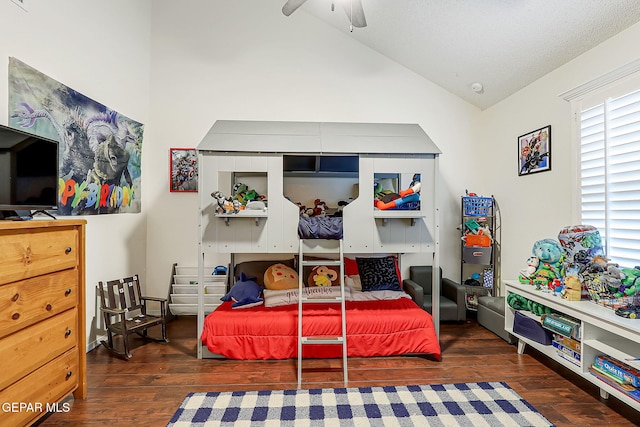 bedroom featuring ceiling fan, dark hardwood / wood-style floors, and multiple windows