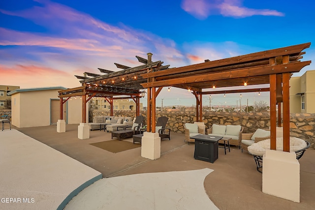 patio terrace at dusk with a pergola and an outdoor hangout area