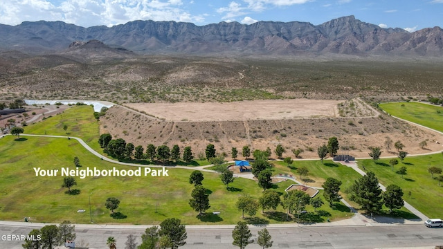 birds eye view of property with a mountain view