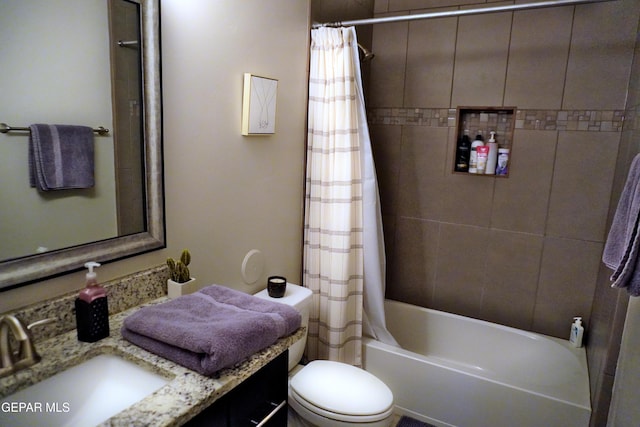 full bathroom with vanity, shower / bath combination with curtain, and toilet