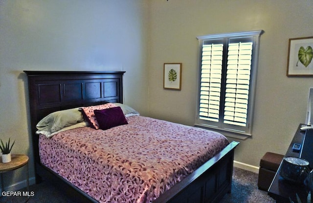 bedroom with dark carpet