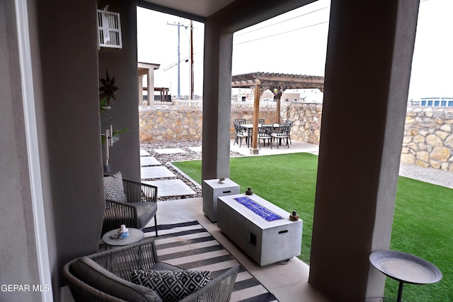 view of patio featuring a pergola and an outdoor living space with a fire pit