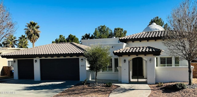 mediterranean / spanish-style house featuring a garage