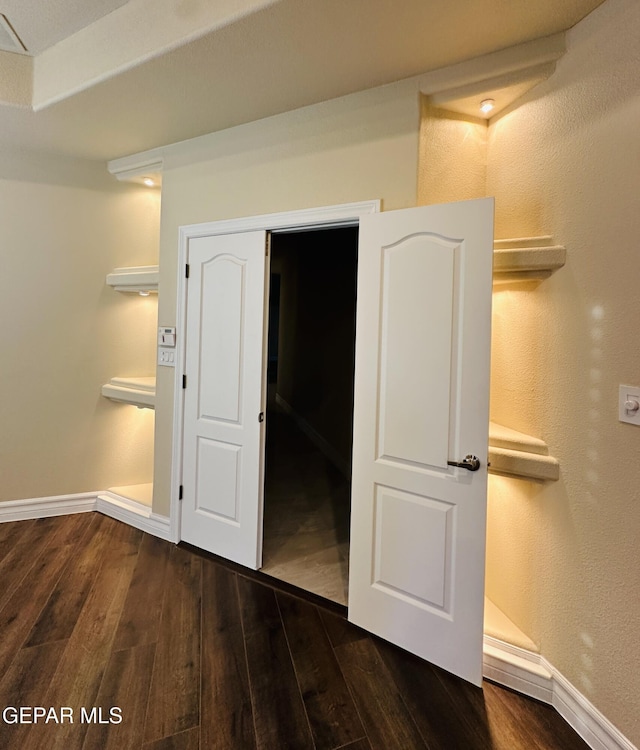 unfurnished bedroom featuring dark hardwood / wood-style floors