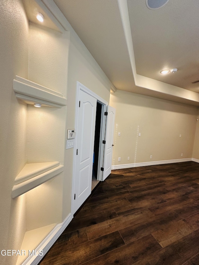 basement with dark wood-type flooring