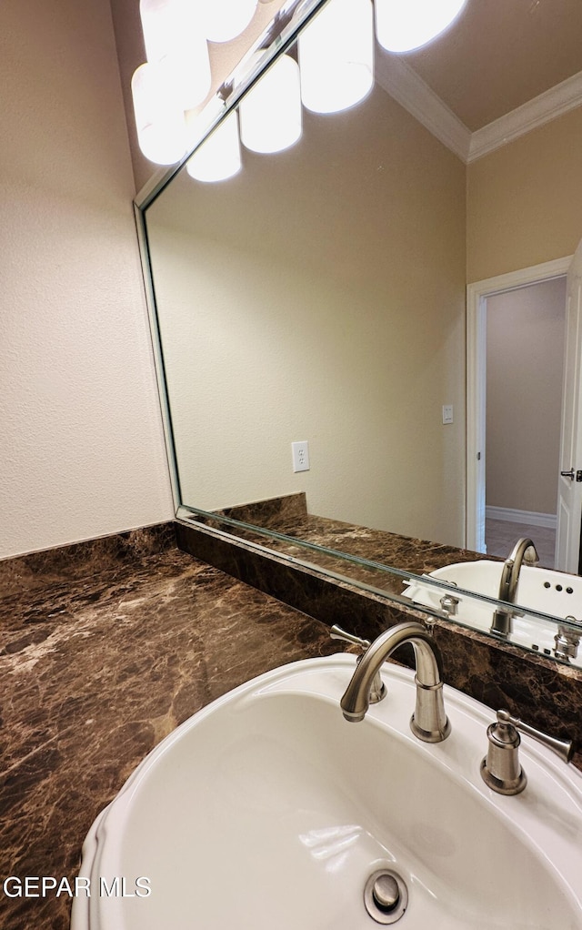 bathroom with vanity and crown molding