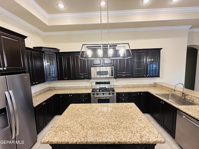 kitchen featuring light stone countertops, sink, hanging light fixtures, stainless steel appliances, and crown molding