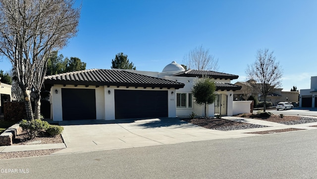 mediterranean / spanish house featuring a garage