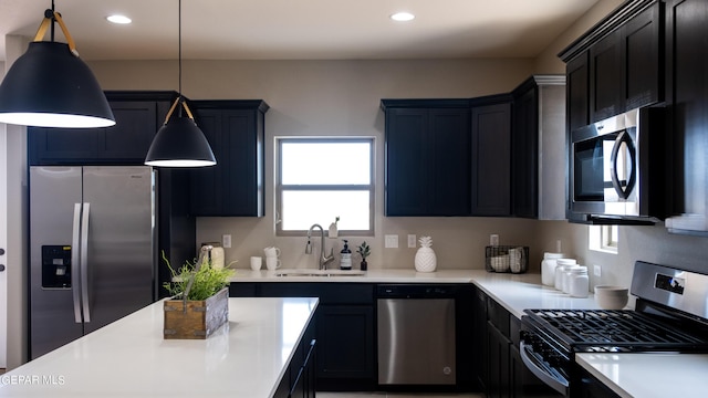 kitchen with hanging light fixtures, a healthy amount of sunlight, sink, and appliances with stainless steel finishes