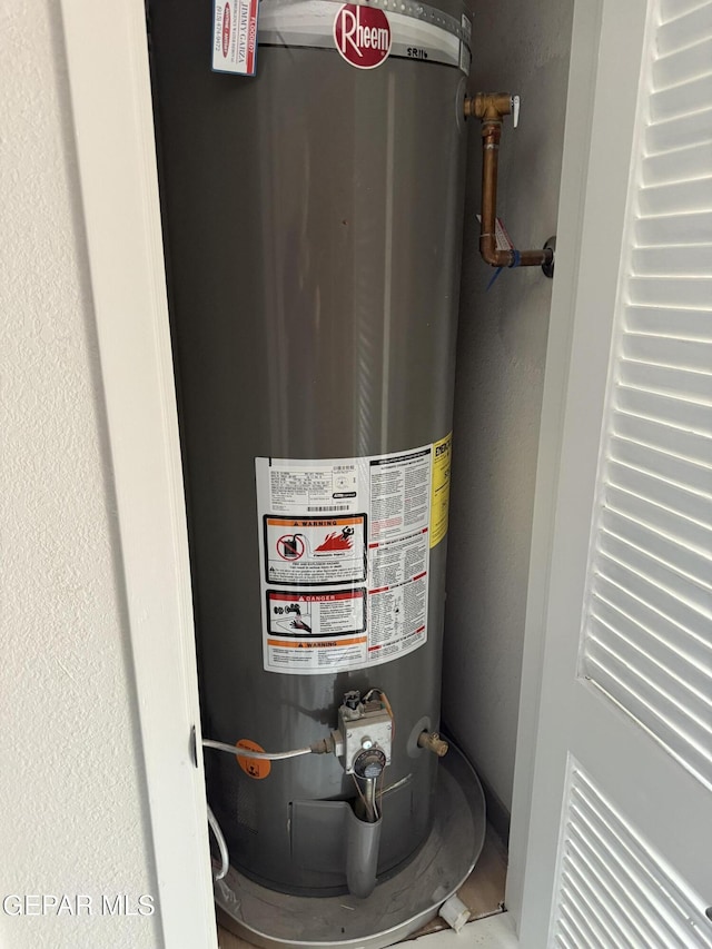 utility room with water heater