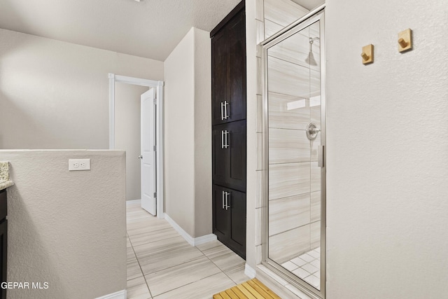 hallway featuring light tile patterned floors