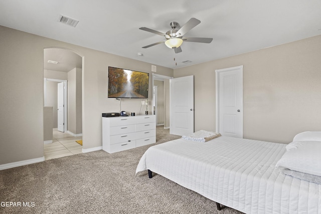 bedroom featuring ceiling fan and light colored carpet