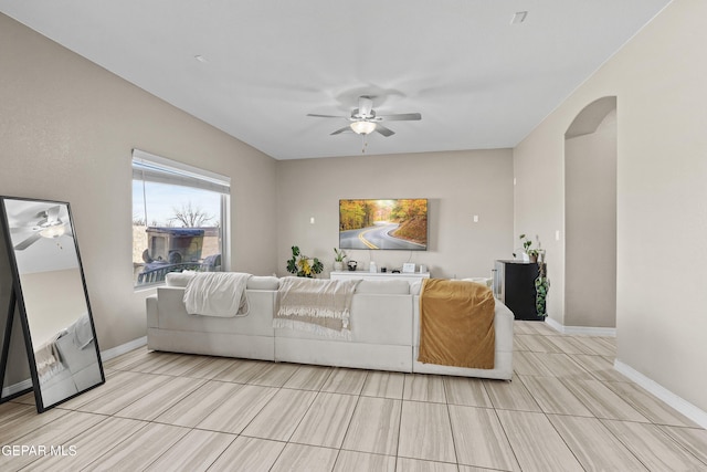 living room with ceiling fan and light wood-type flooring